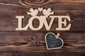 Hearts, love, Valentine`s Day on a dark wooden rustic background