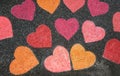 Hearts painted with colored chalk on the street
