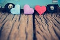 Hearts with part of vintage blue van background on old wooden ta Royalty Free Stock Photo