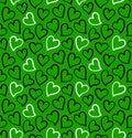 Hearts seamless pattern in black and white colors on the green background. Royalty Free Stock Photo