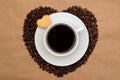 Hearts shaped coffee beans, cup of coffee and cookies Royalty Free Stock Photo