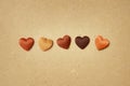 Hearts in skin colors on recycled paper background - Stop racism concept Royalty Free Stock Photo