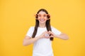 Hearts style. Portrait of a funny girl wearing cool party glasses. Cheerful young girl smiling with heart-shape glasses Royalty Free Stock Photo
