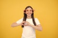 Hearts style. Portrait of a funny girl wearing cool party glasses. Cheerful young girl smiling with heart-shape glasses Royalty Free Stock Photo