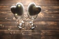 Hearts with wine glasses. Romantics love concept. Festive background. Valentines day postcard. Lights and lamps