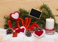 Hearts and the word love made of cloth with burning candle. Royalty Free Stock Photo