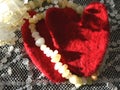 Hearts and yellow beads on a lace