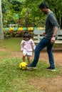 Indian Father and Daughter Playing Football in the Park Royalty Free Stock Photo