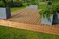 It is a heartwood that has a yellowish-brown to greenish appearance when fresh. separate wooden terrace on the lawn with fiberglas