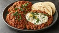 Hearty Bean Dish with Eggs and Tortillas Royalty Free Stock Photo