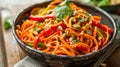 A hearty bowl of spicy carrot noodles topped with fresh herbs, offering a delicious blend of textures and flavors