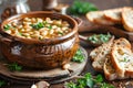 Hearty bowl of white bean stew with vegetables and herbs. The dish is garnished with parsley and served with slices of