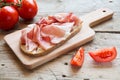 Hearty bread with ham bacon on a wooden board Royalty Free Stock Photo