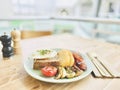 A hearty breakfast on the background of a shopping mall.