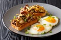 Hearty breakfast of fried toast with shiitake mushrooms and cheddar cheese served with eggs close-up on a plate. horizontal Royalty Free Stock Photo