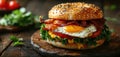 Hearty Breakfast Sandwich on a Bagel with Egg Bacon and Cheese Royalty Free Stock Photo