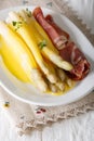 Hearty breakfast: white asparagus served with hollandaise sauce Royalty Free Stock Photo