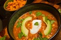 Hearty Chicken Enchilada Soup with Avocado and Sour Cream Garnish Close-Up Royalty Free Stock Photo