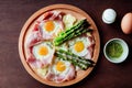 Hearty creamy asparagus tart with ham pieces and egg