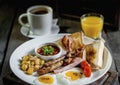 Hearty English lunch served with coffee and orange juice. Royalty Free Stock Photo