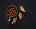 Goulash soup with bread and chilli