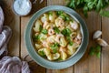 A hearty lunch for the whole family: Pasta with shrimp in cream sauce with parmesan in a beautiful green plate on wooden Royalty Free Stock Photo