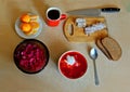 Hearty Russian lunch: borsch with sour cream, sauerkraut salad, rye bread, salted lard, three tangerines and black coffee.