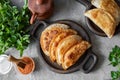 Hearty snack: chebureks. Pasties with meat on a beautiful plate. View from above.