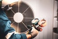 Heat and Air Conditioning, HVAC system service technician using measuring manifold gauge checking refrigerant and filling Royalty Free Stock Photo