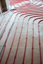 Heat floor instalation. Repair, engineering. Underfloor heating technology. Construction work, repair. Royalty Free Stock Photo