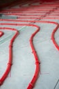 Heat floor instalation. Repair, engineering. Underfloor heating technology. Construction work, repair Royalty Free Stock Photo