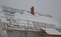 The heat from the house passes through the roof and melts the snow. it freezes in the eaves of the roof and forms icicles. repel t Royalty Free Stock Photo