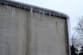 heat from the house passes through the roof and melts the snow.