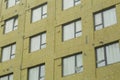 Heat insulation during the construction of an apartment building. Installation of industrial heat protection at a house