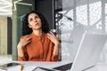 The heat in the office, the air conditioner is broken, the worker is trying to cool down by waving her hands, the Royalty Free Stock Photo