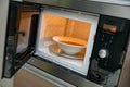 Heat up food in microwave oven