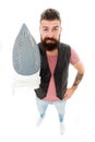 Heat up iron. Man bearded hipster hold electric ironing tool. How to iron clothes correctly. Be careful. Guy with iron