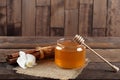 Heather honey and cinnamon on wooden table Royalty Free Stock Photo