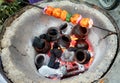 Heating clay pots in coal to make tea Royalty Free Stock Photo