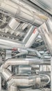 Heating and cooling pipe system with exhaust silencer in a heating plant Royalty Free Stock Photo