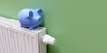 Heating cost saving. Piggy bank on heater radiator, warm house room interior