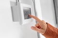 hand setting room temperature on sensor at home Royalty Free Stock Photo