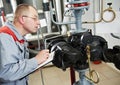 Heating engineer in boiler room Royalty Free Stock Photo