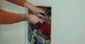 Heating engineer installing modern heating system for underfloor heating.