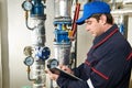 Heating engineer repairman in boiler room