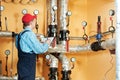 Heating engineer repairman in boiler room