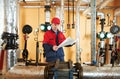 Heating engineer repairman in boiler room