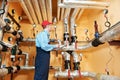 Heating engineer repairman in boiler room