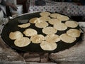 Heating mexican tortillas on a comal