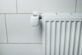 Heating with panel radiator and heat cost allocator and thermostat on the wall Royalty Free Stock Photo